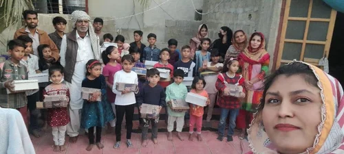 Children and families at a shoe distribution.